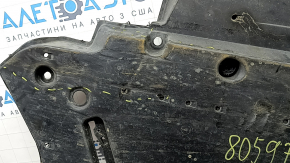 The front left underbody protection of Toyota Venza 21-24 is dented and scuffed.