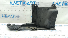 The right side engine guard of a Toyota Prius 50 16-18 is worn and torn.