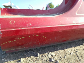 The center left pillar of the Tesla Model 3 18 is sawn off, the threshold is dented.