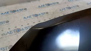 The hood of a Ford Ecosport 18-22 is bare steel and dented.