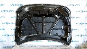 The hood of a Mazda CX-5 17-24 steel is bare and dented.