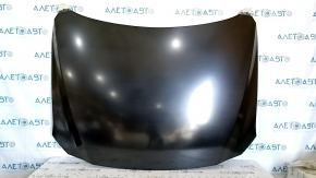 The hood of a Mazda CX-5 17-24 steel is bare and dented.