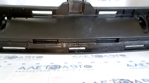 The bare front bumper of a 2020 Hyundai Sonata US SE without parking sensors is cracked.