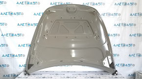The hood of a Tesla Model Y 20-25 is dented.