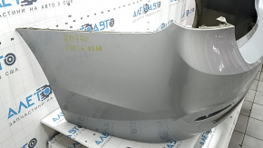 Bare rear bumper BMW 3 F30 16-18 without parking sensors, under molding, silver, scratches, broken mount, dent