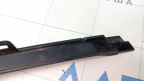 Front bumper center molding for BMW 3 Series F30 16-18, gloss black. Faded, chipped.