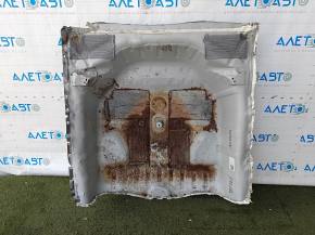 The trunk trough of the Honda Accord 23-24 is drilled out, dented, and has tears.