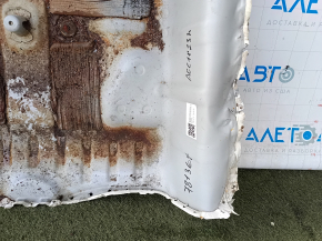 The trunk trough of the Honda Accord 23-24 is drilled out, dented, and has tears.
