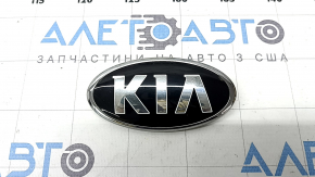 The Kia Sportage 17-22 front bumper logo has blistered paint.