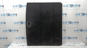 The trunk floor of a Kia Sportage 17-22 is black, with scratches on the handle.