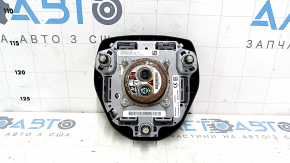 The driver's side airbag in the Toyota Camry V70 18-24 is black and has a rusty squib.