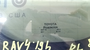 Rear left Toyota Rav4 19-24 window, tinted, with chrome molding, scratches, torn seal