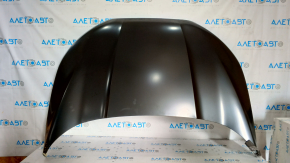 The hood of a Ford Ecosport 18-22 is bare steel, with a dent and a broken corner.