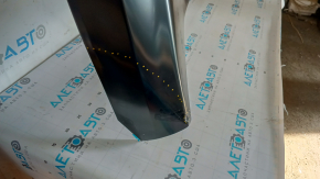 The hood of a Ford Ecosport 18-22 is bare steel, with a dent and a broken corner.