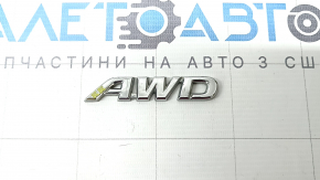 The "AWD" emblem is on the rear right door of a Toyota Rav4 19-24.