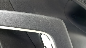 The door trim panel, rear left, Toyota Rav4 19-24, is black, the armrest is black leather, the insert is black plastic, the molding with the handle is gray, scratches are visible.