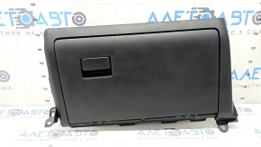 The glove compartment of a Toyota Rav4 19-21 is black and has scratches.