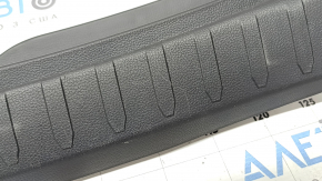 The trunk opening trim for a Toyota Rav4 19-24 is black, with scratches and whitened plastic.