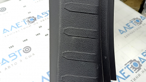 The trunk opening trim for a Toyota Rav4 19-24 is black, with scratches and whitened plastic.