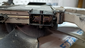 The diffuser radiator shroud assembly for a Toyota Camry V70 18-24 hybrid has broken studs.