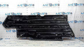 The left underbody protection of a Toyota Camry v70 18-24 is torn.
