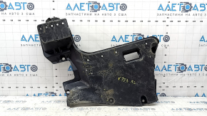 The rear left underbody protection of a Toyota Camry v70 18-24 hybrid is torn.