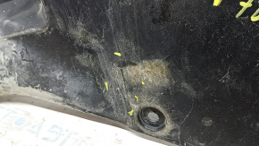The rear left underbody protection of a Toyota Camry v70 18-24 hybrid is torn.