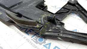 The lower deflector of the front bumper of the Toyota Camry v70 18-24 USA plastic is cracked.