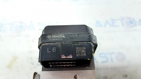 The brake master cylinder with reservoir for a Toyota Camry V70 18-19 hybrid has a broken cap.