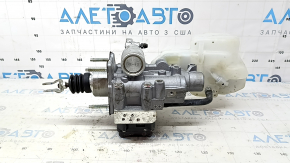 The brake master cylinder with reservoir for a Toyota Camry V70 18-19 hybrid has a broken cap.