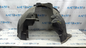 The front right fender liner of a Volvo XC90 16-23 is torn, non-factory holes