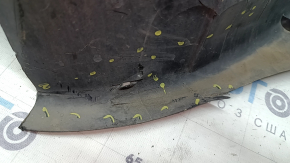 The front right fender liner of a Volvo XC90 16-23 is torn, non-factory holes