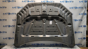 The hood of a Honda CRV 23-25 is bare steel, with damaged edges and corners.
