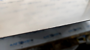 The hood of a Honda CRV 23-25 is bare steel, with damaged edges and corners.