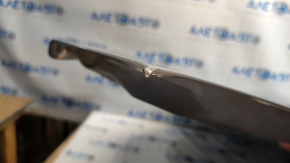 The hood of a Honda CRV 23-25 is bare steel, with damaged edges and corners.