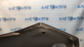 The hood of a Honda CRV 23-25 is bare steel, with damaged edges and corners.