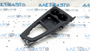 The center console trim with cup holders for the Audi A5 F5 17-19 is black, ebony-like, and the coating is swollen.