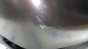 Bare rear bumper of a 17-20 Nissan Rogue without parking sensors, scratches