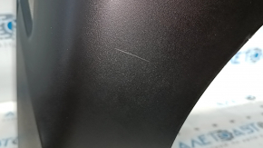 Bare rear bumper of a 17-20 Nissan Rogue without parking sensors, scratches