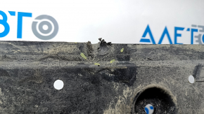 The rear underbody protection of the Nissan Ariya 23-25 AWD is scuffed.