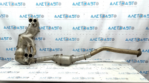 The exhaust manifold with a catalytic converter for a Subaru Forester 19-24 SK is dented.