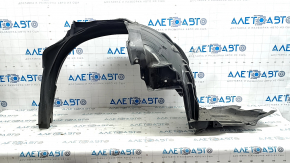 The front left fender liner of a Subaru Forester 19-21 SK is torn.