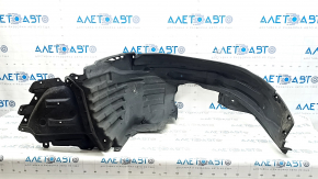 The front left fender liner of a Subaru Forester 19-21 SK is torn.