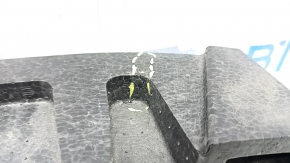 The front bumper absorber of a Subaru Forester 19-21 SK is dented, there is a crack in the fasteners