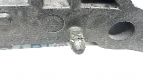 The front bumper absorber of a Subaru Forester 19-21 SK is dented, there is a crack in the fasteners