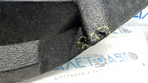 The front bumper absorber of a Subaru Forester 19-21 SK is dented, there is a crack in the fasteners