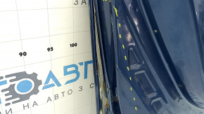 The front left door of a Subaru Forester 19-24 SK blue SAZ is bare and has split at the seam.