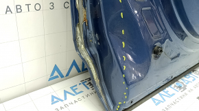 The front left door of a Subaru Forester 19-24 SK blue SAZ is bare and has split at the seam.