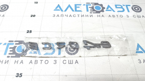 The E-4ORCE emblem is on the tailgate of the Nissan Ariya 23-25.