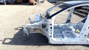 Front left quarter panel of a 2020 Nissan Ariya on a white XGA body
